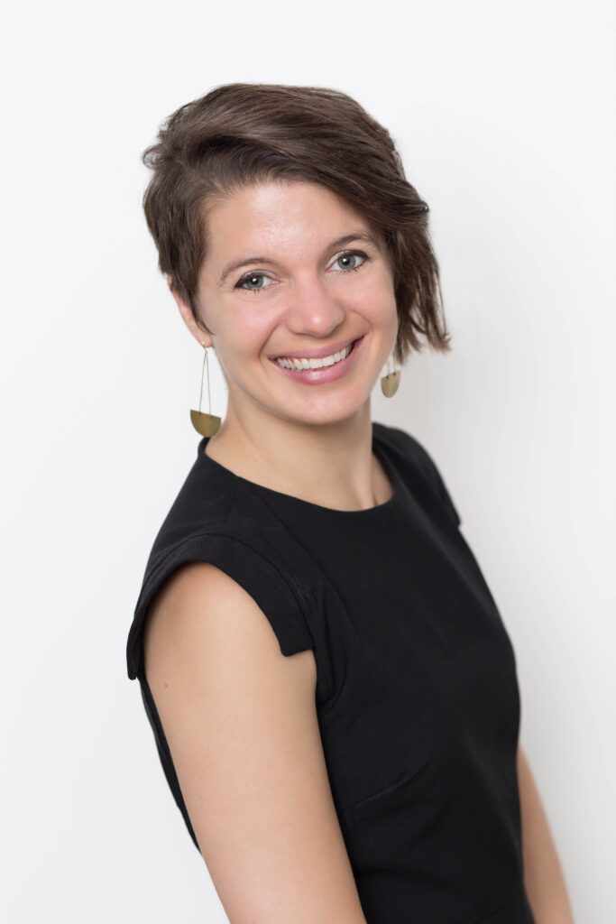 professional headshot of an executive woman in a black dress