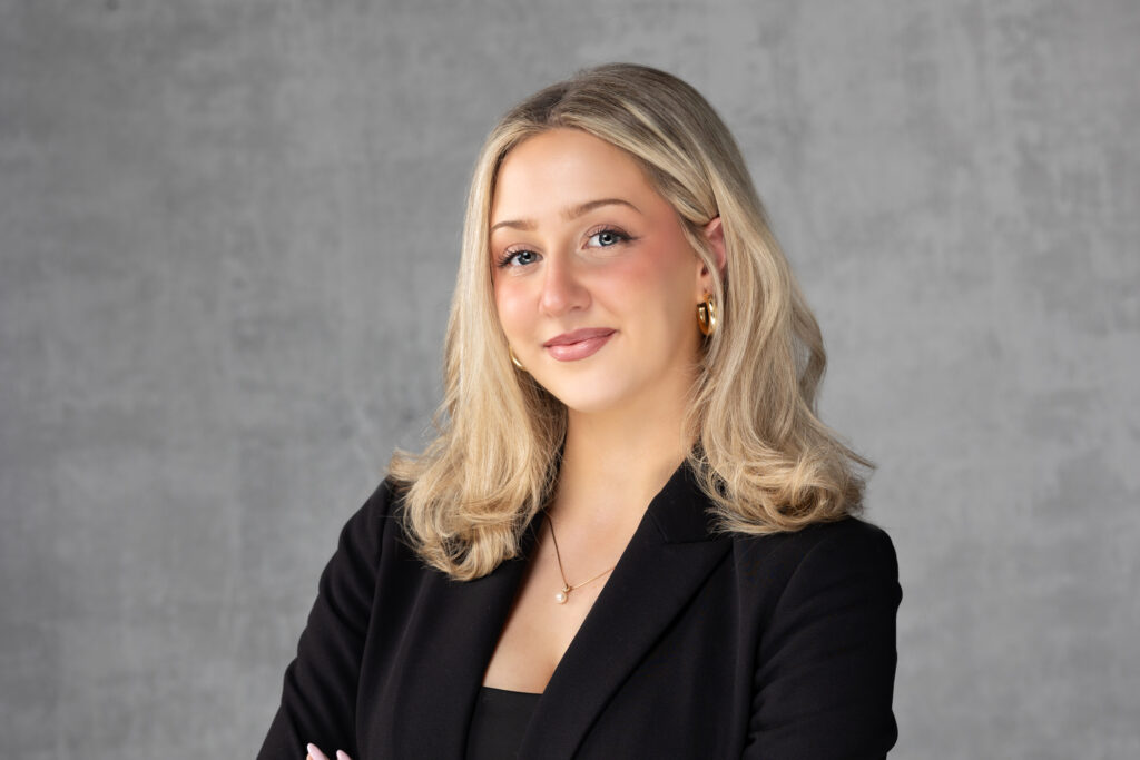 professional headshot in detroit studio of a white woman in black suit . photographed by LeoSage Images